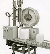 The first canister filling machine